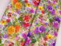 Preview: Patchworkstoff Clothworks Flowershop Ballen mit Rosen in lila und Ballen mit Rosen in gelb rot